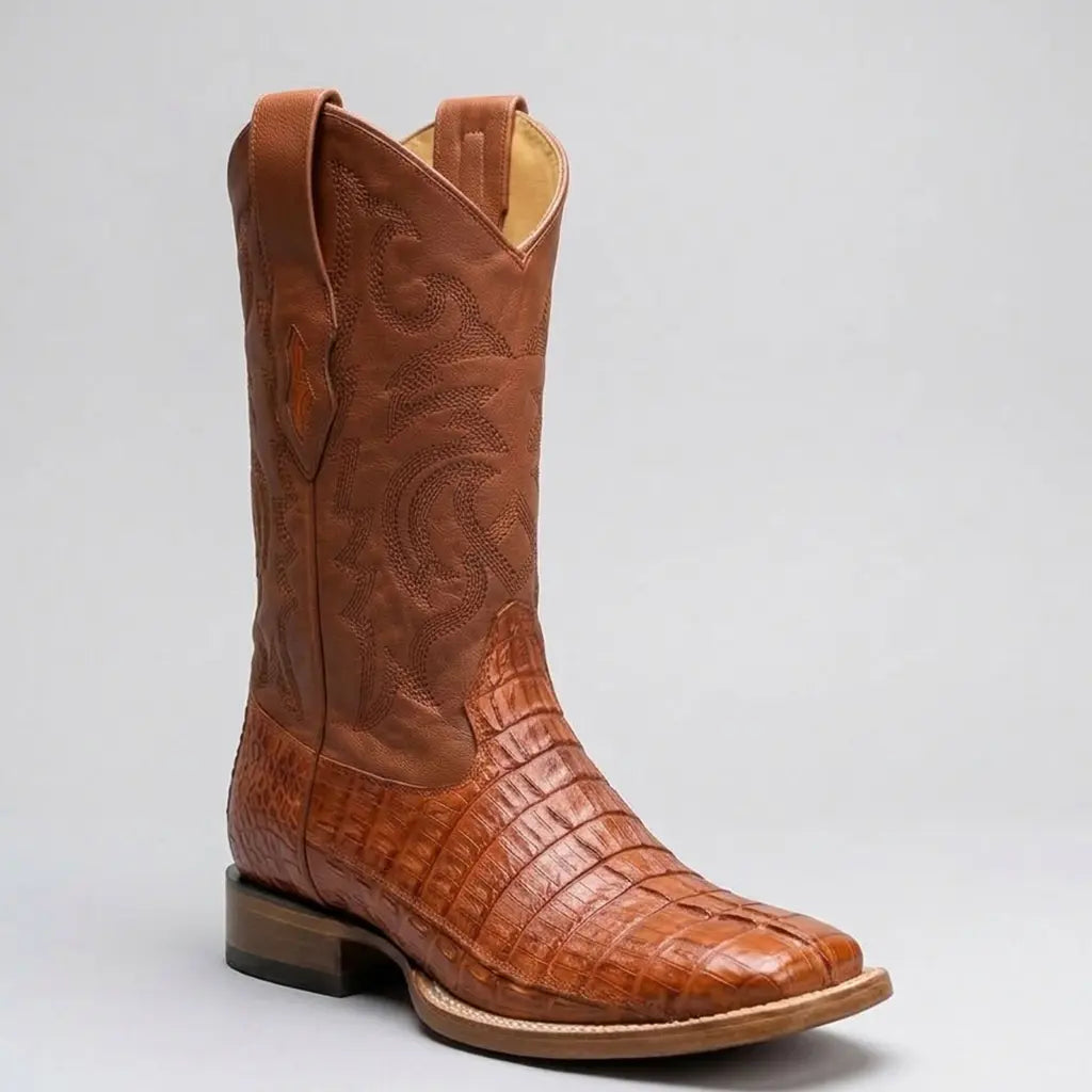Studio profile view of a single Los Altos Men's cognac caiman tail square toe cowboy boot displaying the tail ridge pattern and 12-inch stitched shaft.