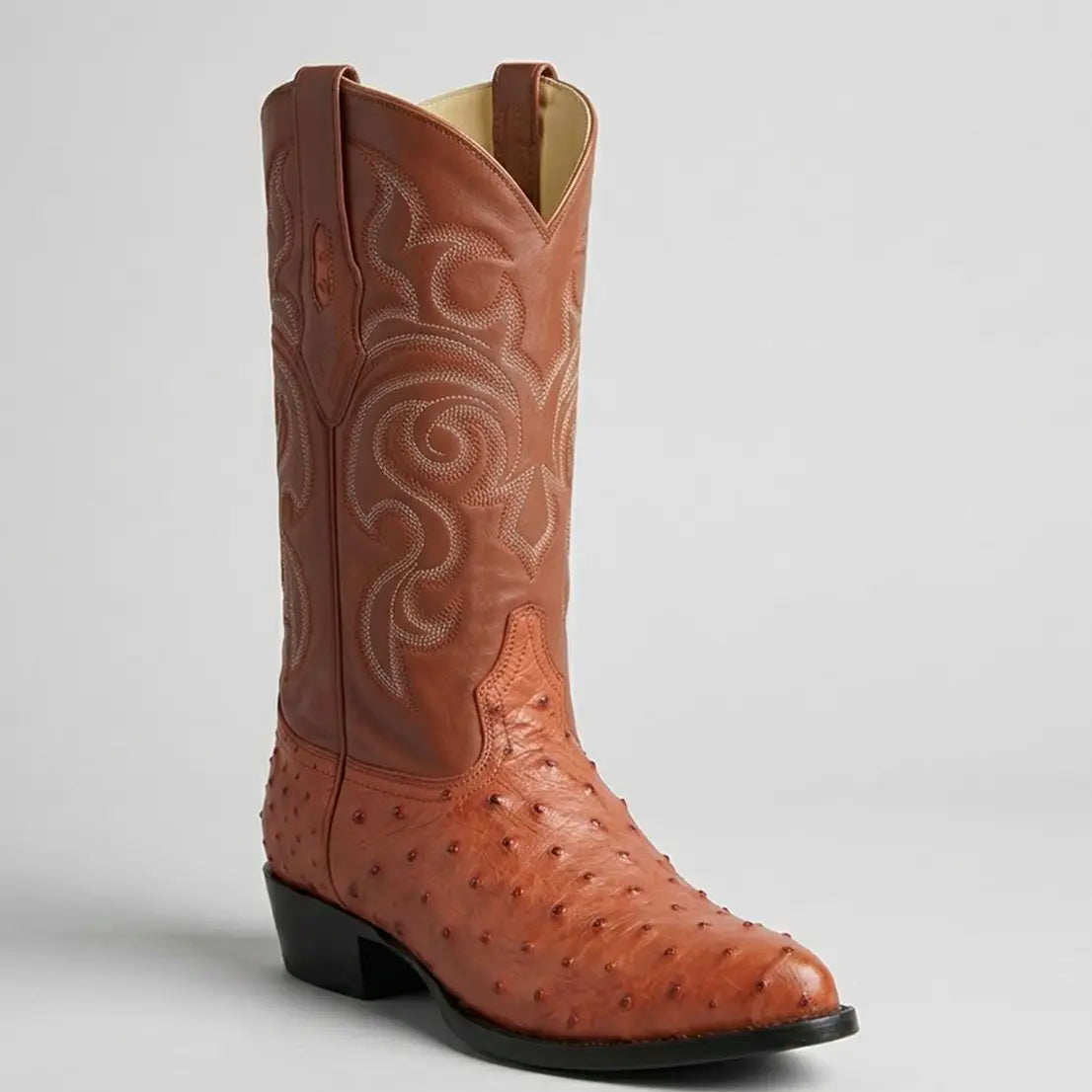 Studio shot of a single Los Altos Men's Cognac full quill ostrich boot displaying the pointed J-toe, prominent quill texture, and Western stitched leather upper.
