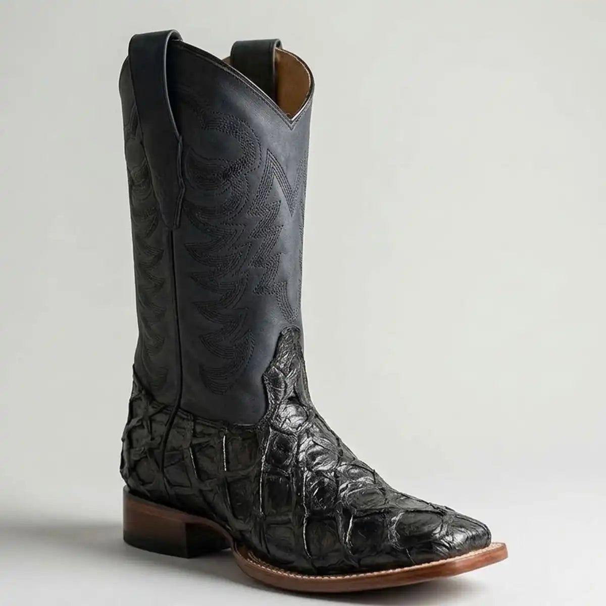 Single boot profile shot of the Los Altos black glossy pirarucu boot highlighting the 1.5" walking heel and Goodyear welt stitching.