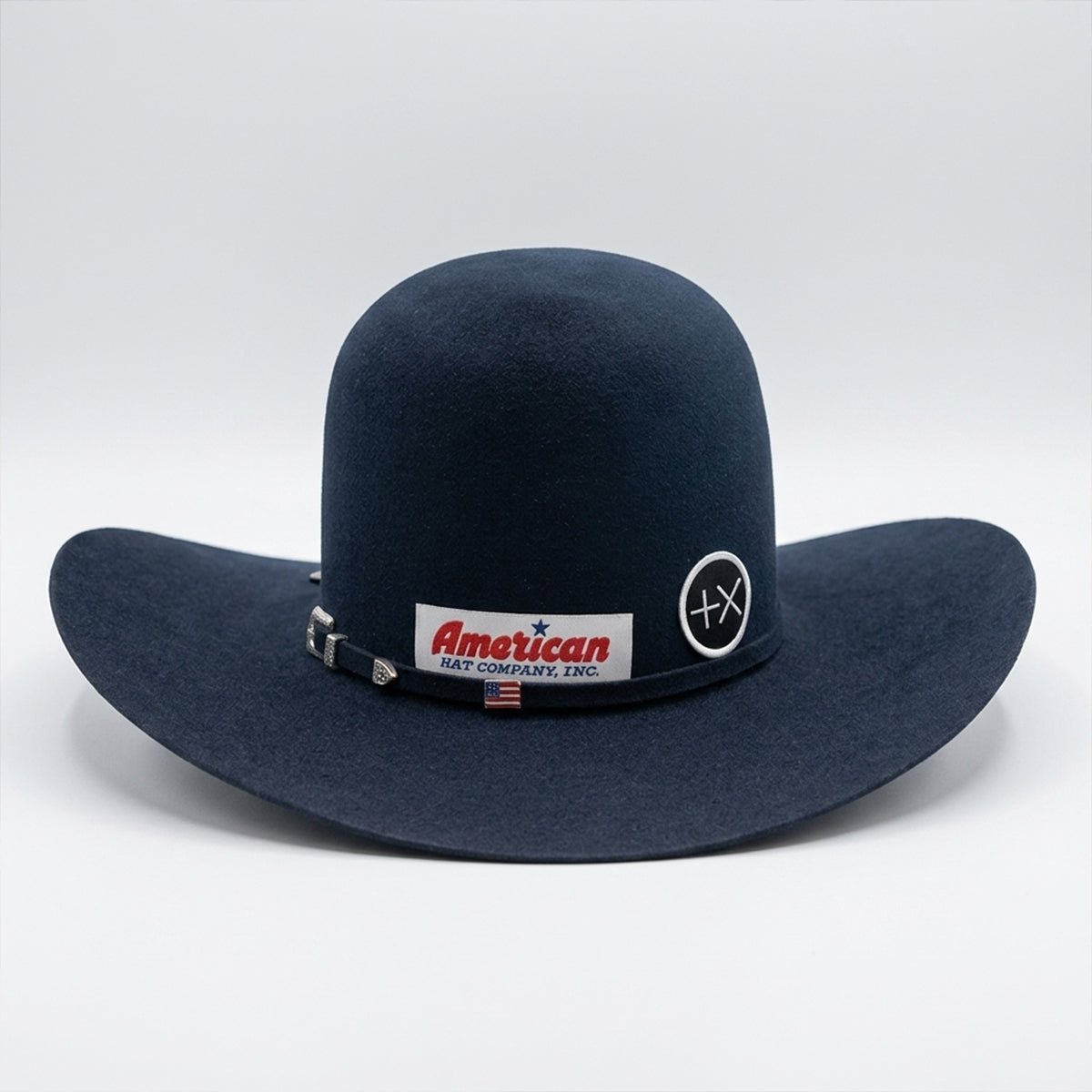 Back view of American Hat Co navy blue cowboy hat with American Hat Company, Inc. logo on a white background.