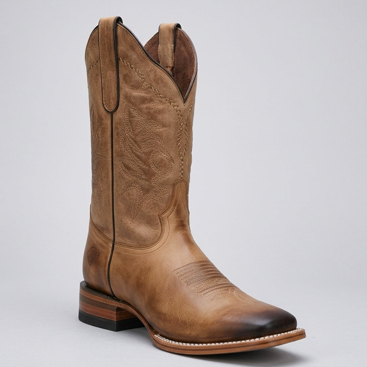 White Diamonds men's light brown tan square toe cowboy boots with burnished shading on the toe box, and an intricately stitched shaft.
