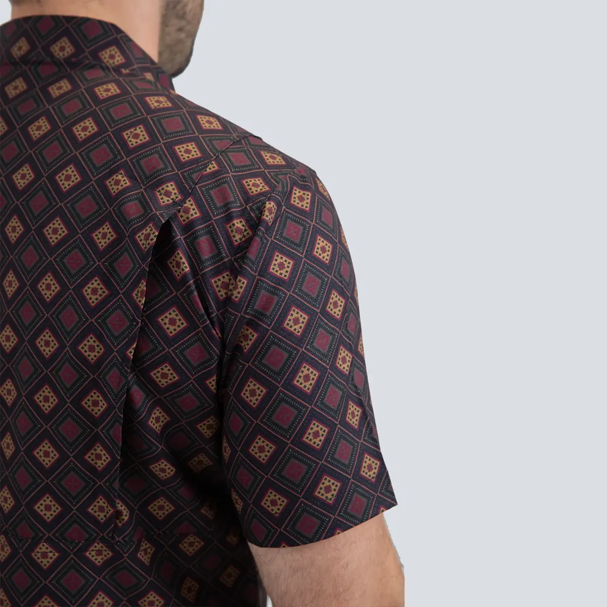 Close-up back shoulder view of the Platini micro-diamond performance shirt showcasing the seam stitching and fabric texture.