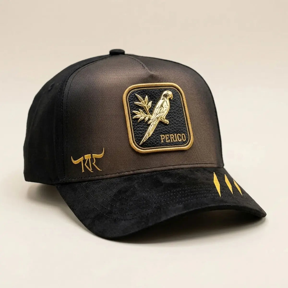 Three-quarter side profile view of The King Ranch "Perico" cap highlighting the gold longhorn side logo and structured brown crown.