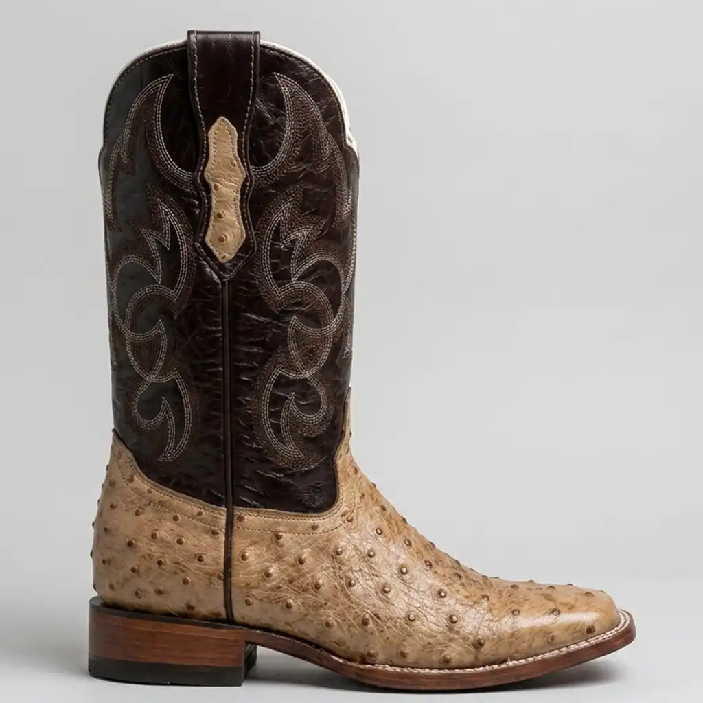 Quincy men's square toe cowboy boot with a tan ostrich print leather foot and a dark brown shaft featuring western embroidery, photographed on a neutral light gray background.