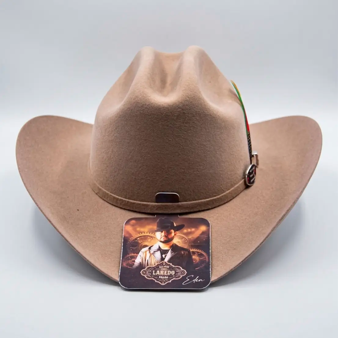 Straight front-facing view of the camel wool Eden Muñoz tejana hat displaying the symmetrical brim shape and EM metal logo buckle.