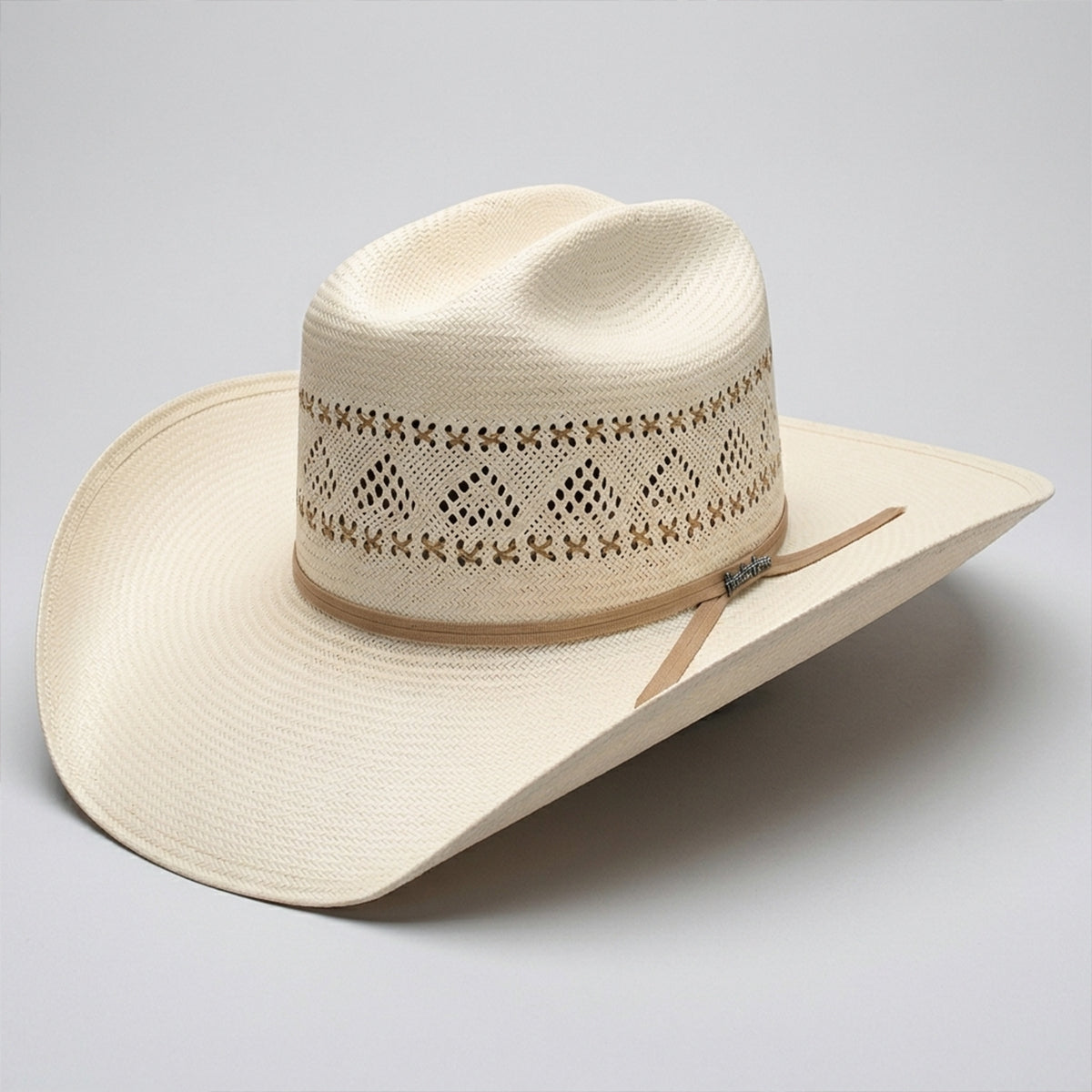 Tombstone Roper 30X natural straw cowboy hat with diamond vented crown, tan X-stitch embroidery, ribbon band, and metallic pin logo.