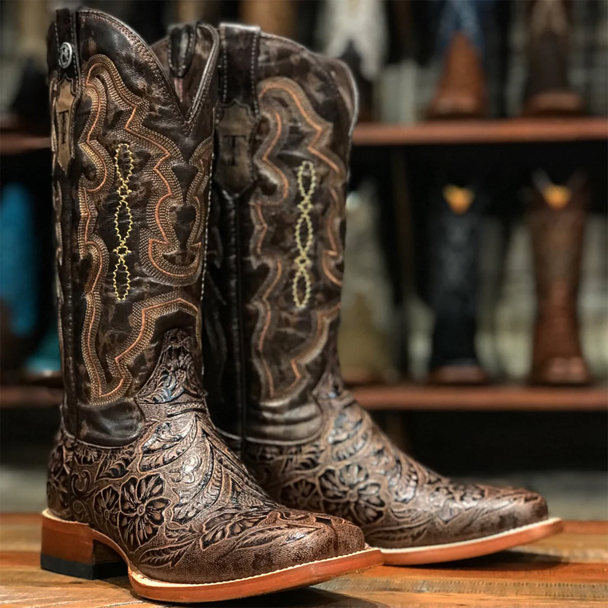 Brown tooled cowgirl boots by Tanner Mark
