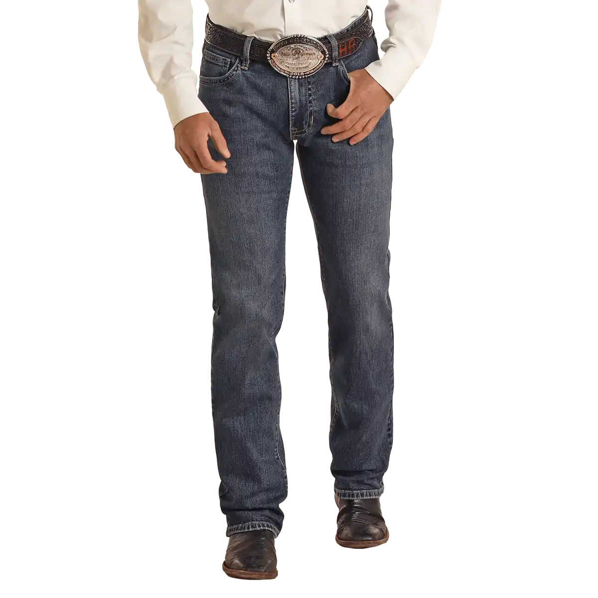 Studio front view of a man wearing Rock & Roll Denim Vintage '46 Revolver medium wash slim straight jeans with Western belt and boots.