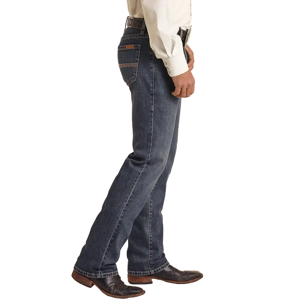 Studio side view of a man wearing Rock & Roll Denim Vintage '46 Revolver medium wash slim straight jeans with Western belt and boots.
