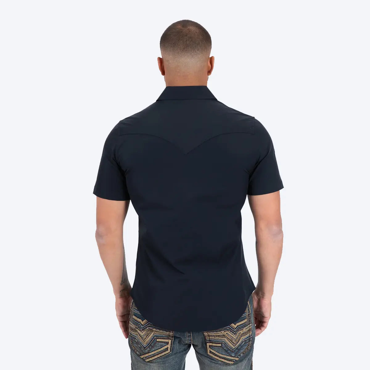 Back studio view of a male model wearing the Platini Prewitt black performance shirt showing the pointed back Western yoke.