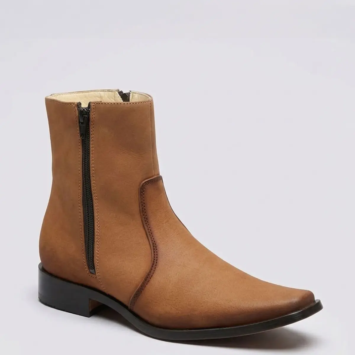 Studio side profile of the El Besserro Men's Tan Nubuck leather Western dress ankle boot displaying the narrow square toe, 7-inch shaft, and side zipper.