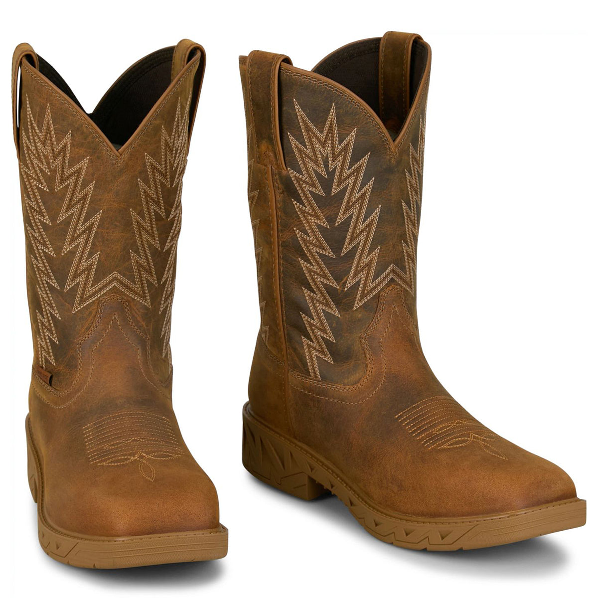 Pair of Justin brown steel square toe cowboy boots with intricate stitching on a white background.
