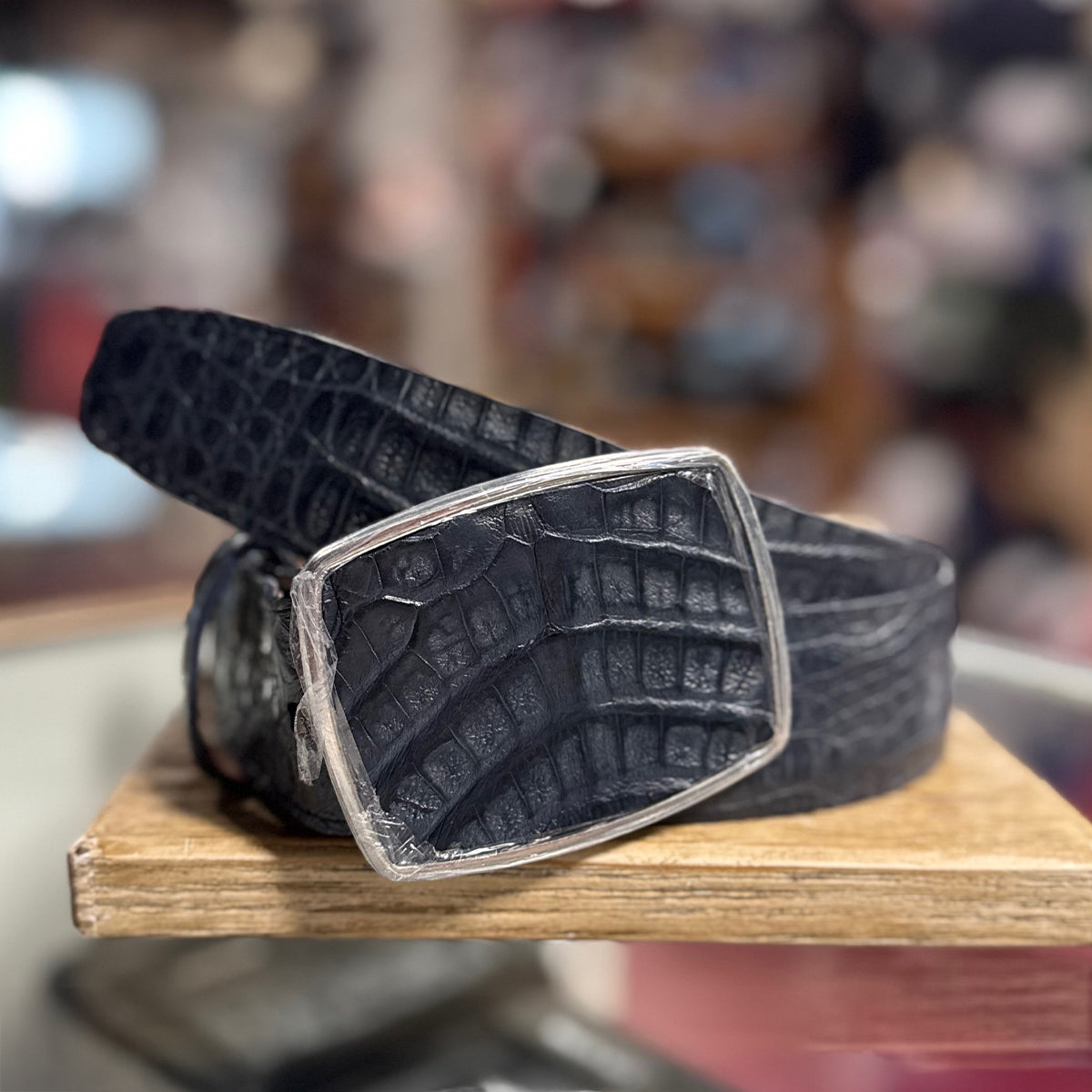 Los Altos navy blue caiman hornback leather  belt with a silver buckle.