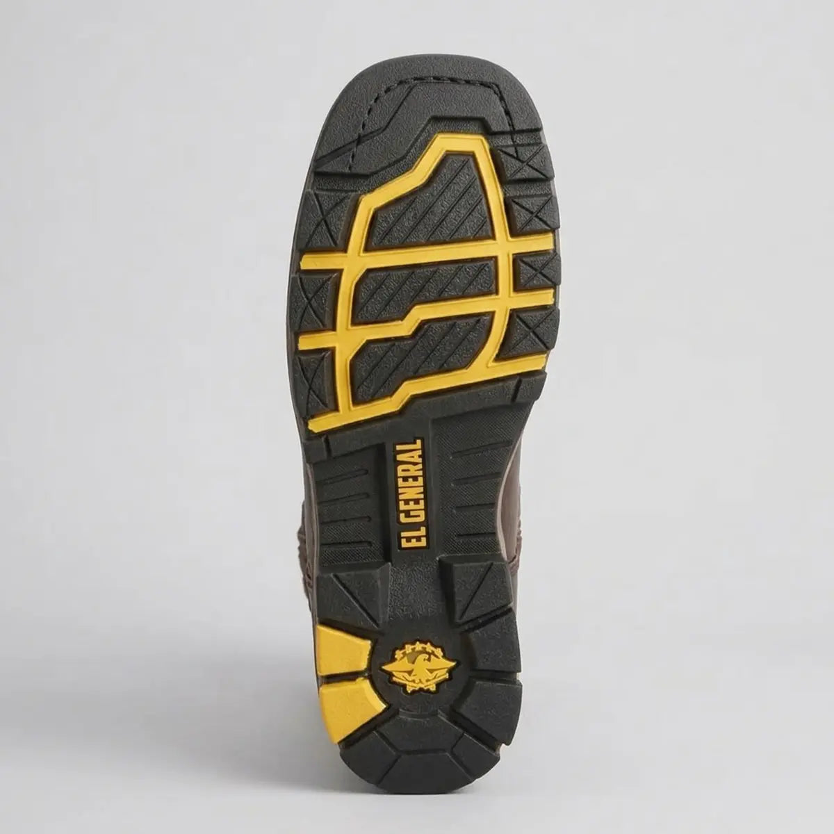Bottom view of the El General men's work boot displaying the heavy-duty tractor rubber outsole with deep slip-resistant tread, yellow accent lugs, squared toe profile, and embossed El General branding.
