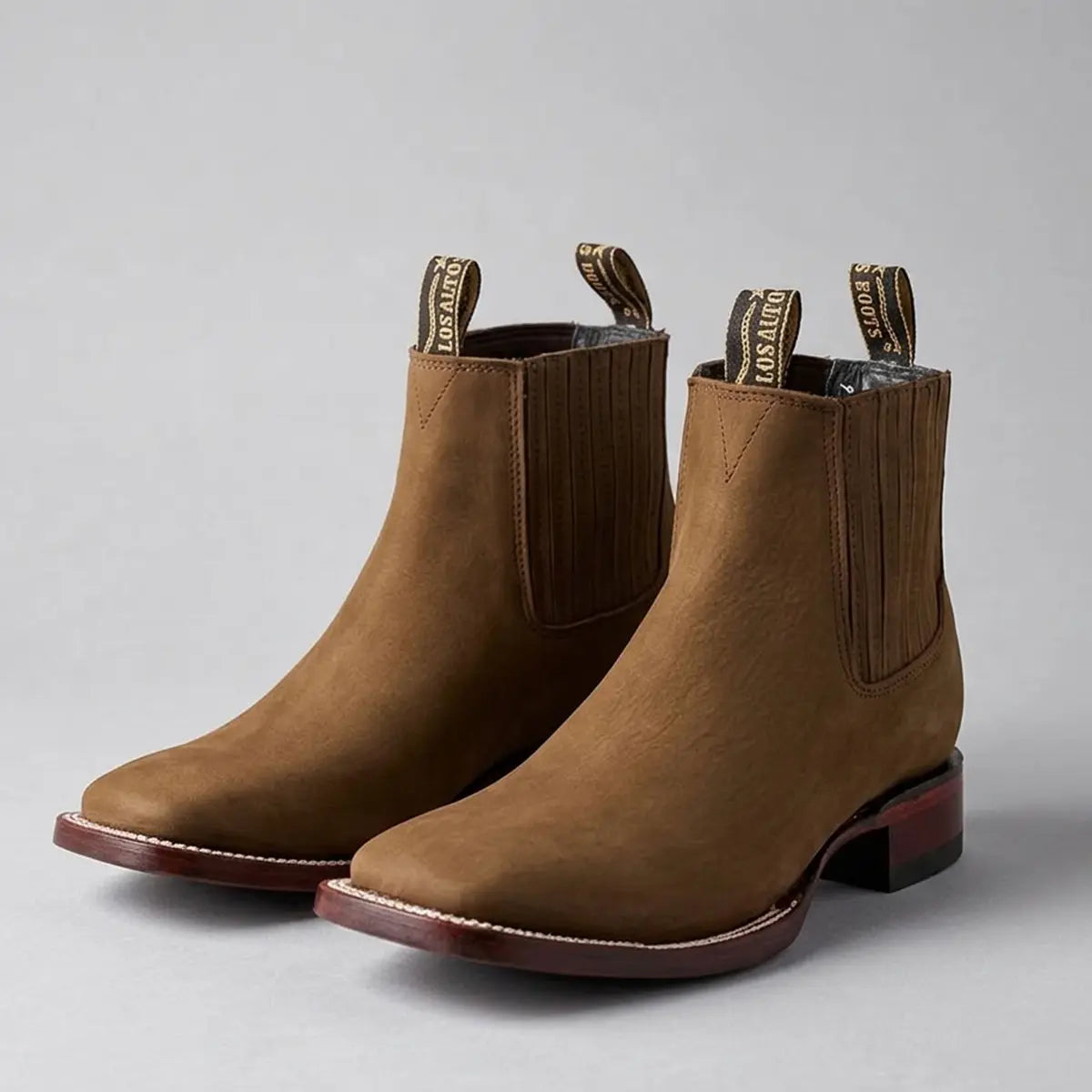 Pair studio view of the Los Altos brown nubuck Chelsea boots showcasing the wide square toe profile and contrast welt stitching.