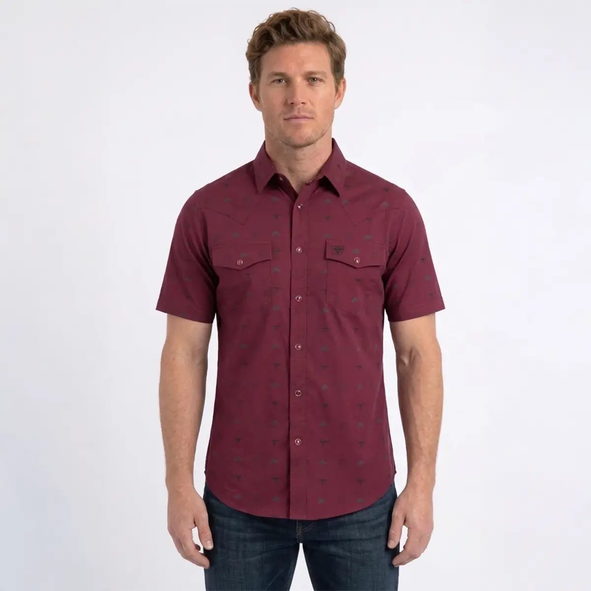 Front studio view of a male model wearing the Platini burgundy short sleeve Western snap shirt showing the collar, dual chest pockets, and icon pattern.