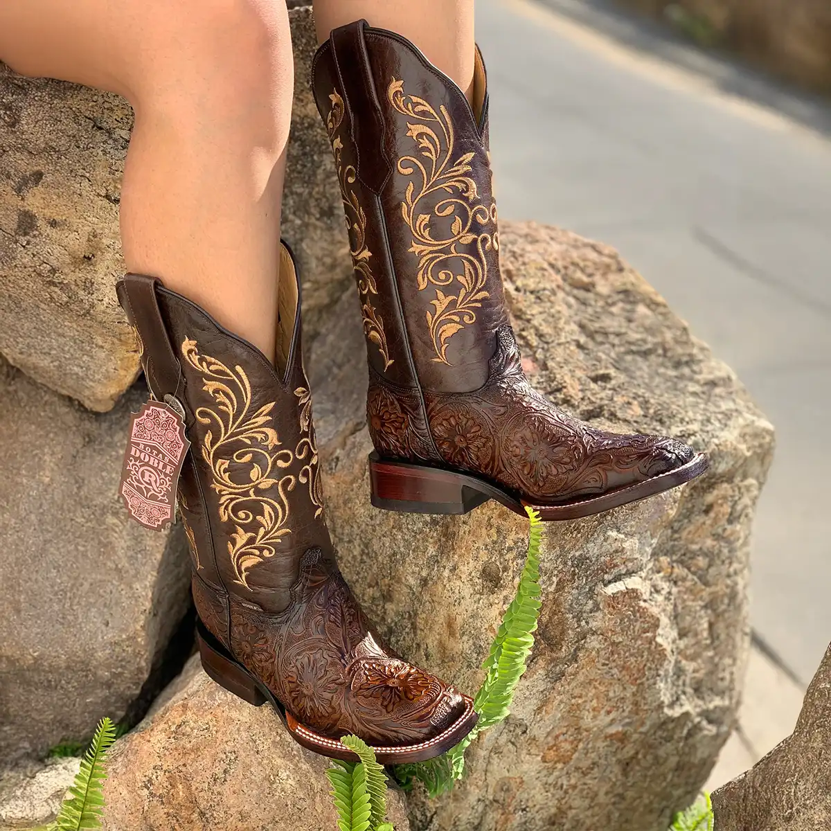 Botas Doble R women's dark brown floral tooled print cowboy boots featuring intricate golden Western stitching on the shaft and a square toe.