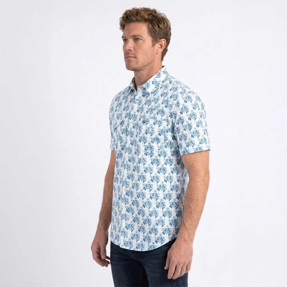 Three-quarter side profile view of a male model wearing the Platini white short sleeve floral snap shirt.