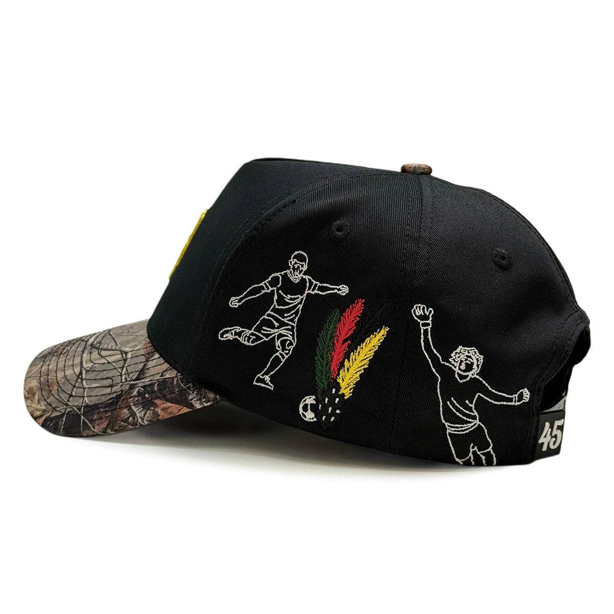 Mexico black cap with white soccer and feather graphics and a camouflage brim on a white background.