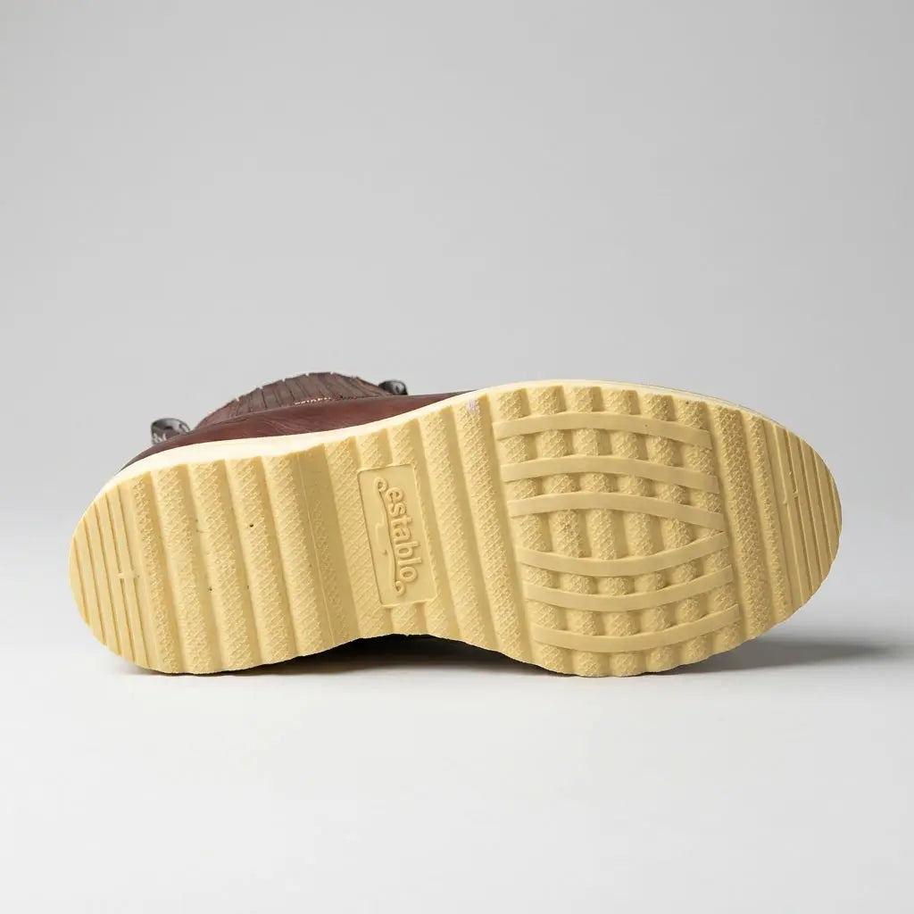 Bottom view of the Establo cream polyurethane wedge outsole showing the textured tread pattern and stamped Establo logo.