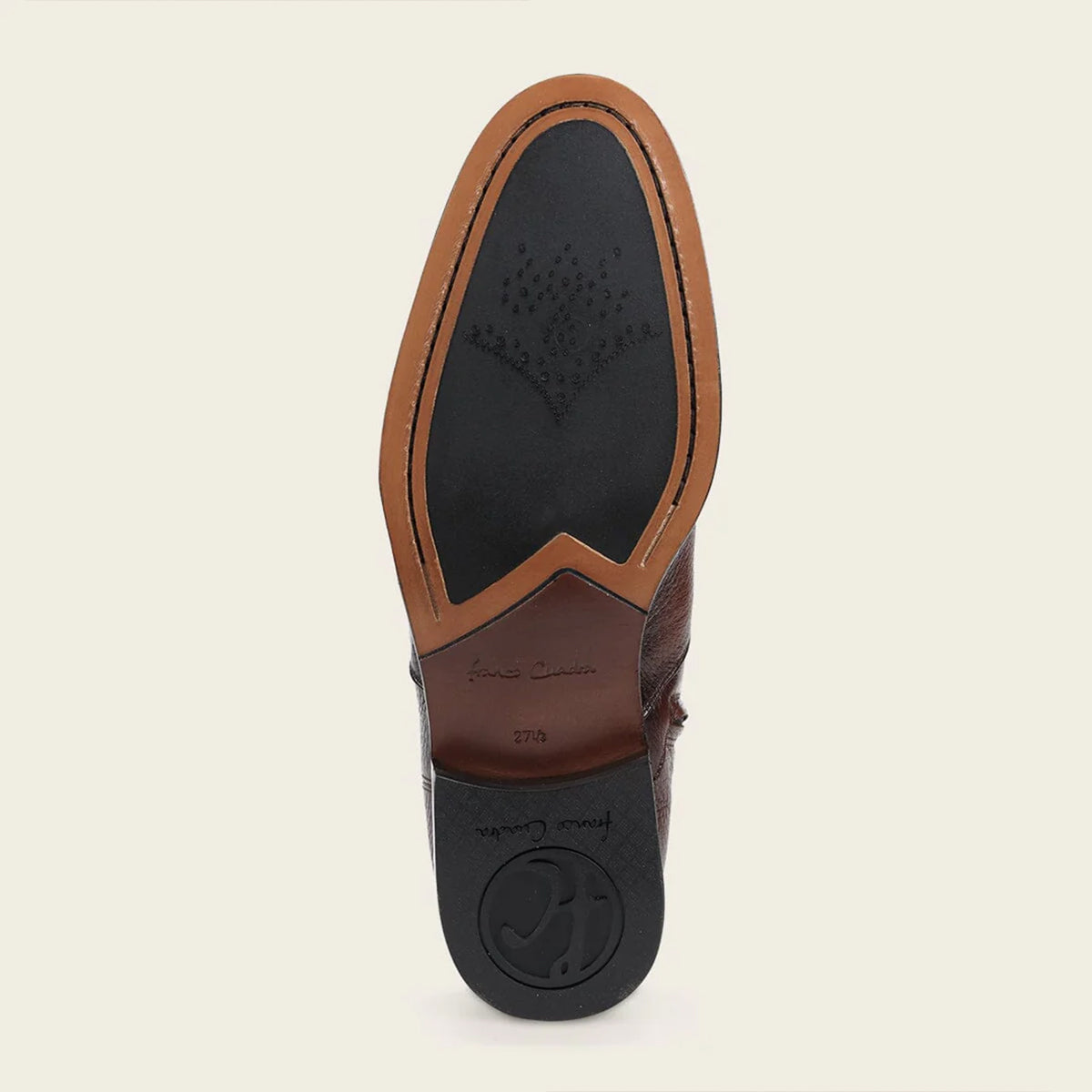 Close-up of Cuadra leather shoe sole on a beige background.