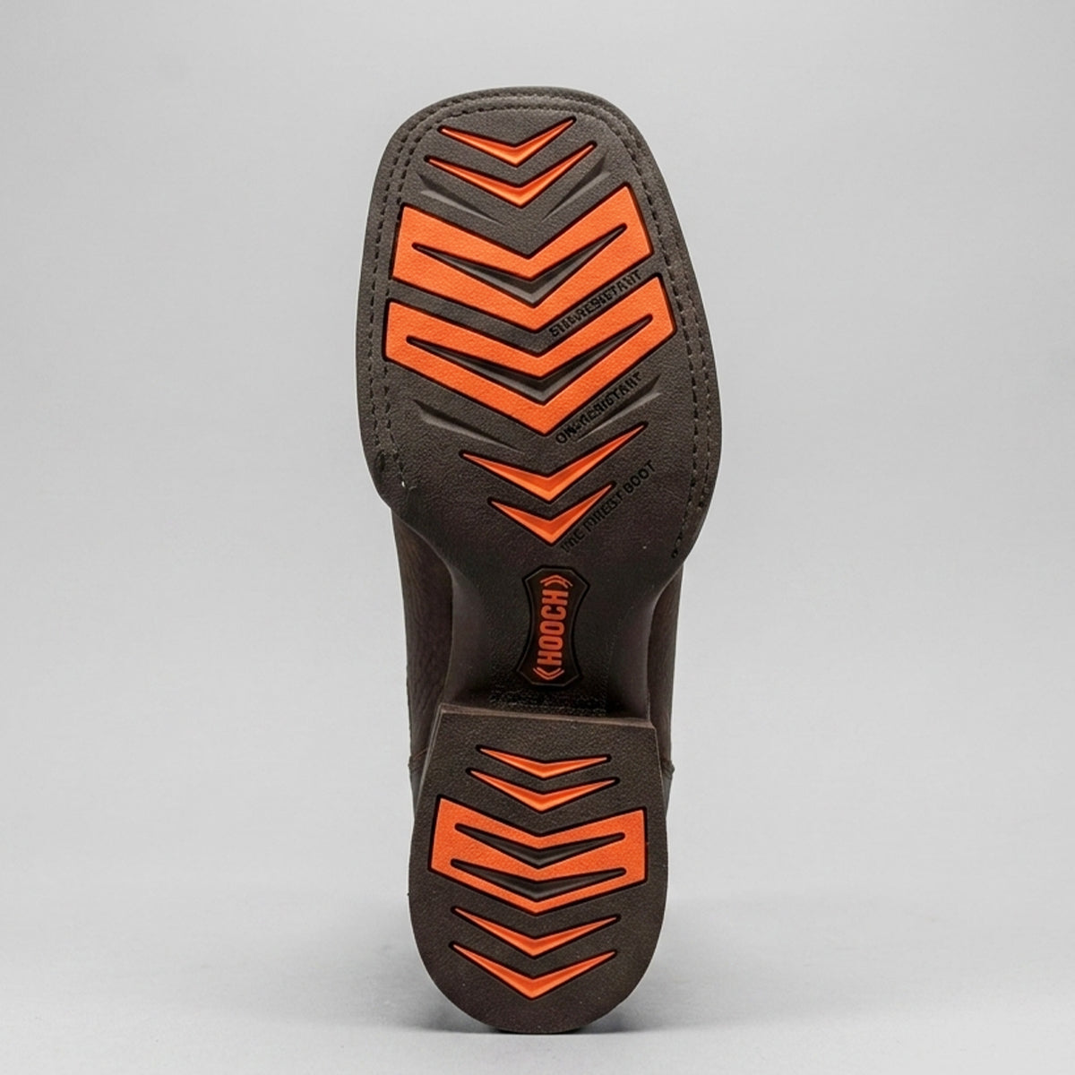Close-up of a Hooch rubber sole with orange tread pattern on a gray background.