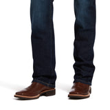 leg of Ariat M5 Jeans with boots